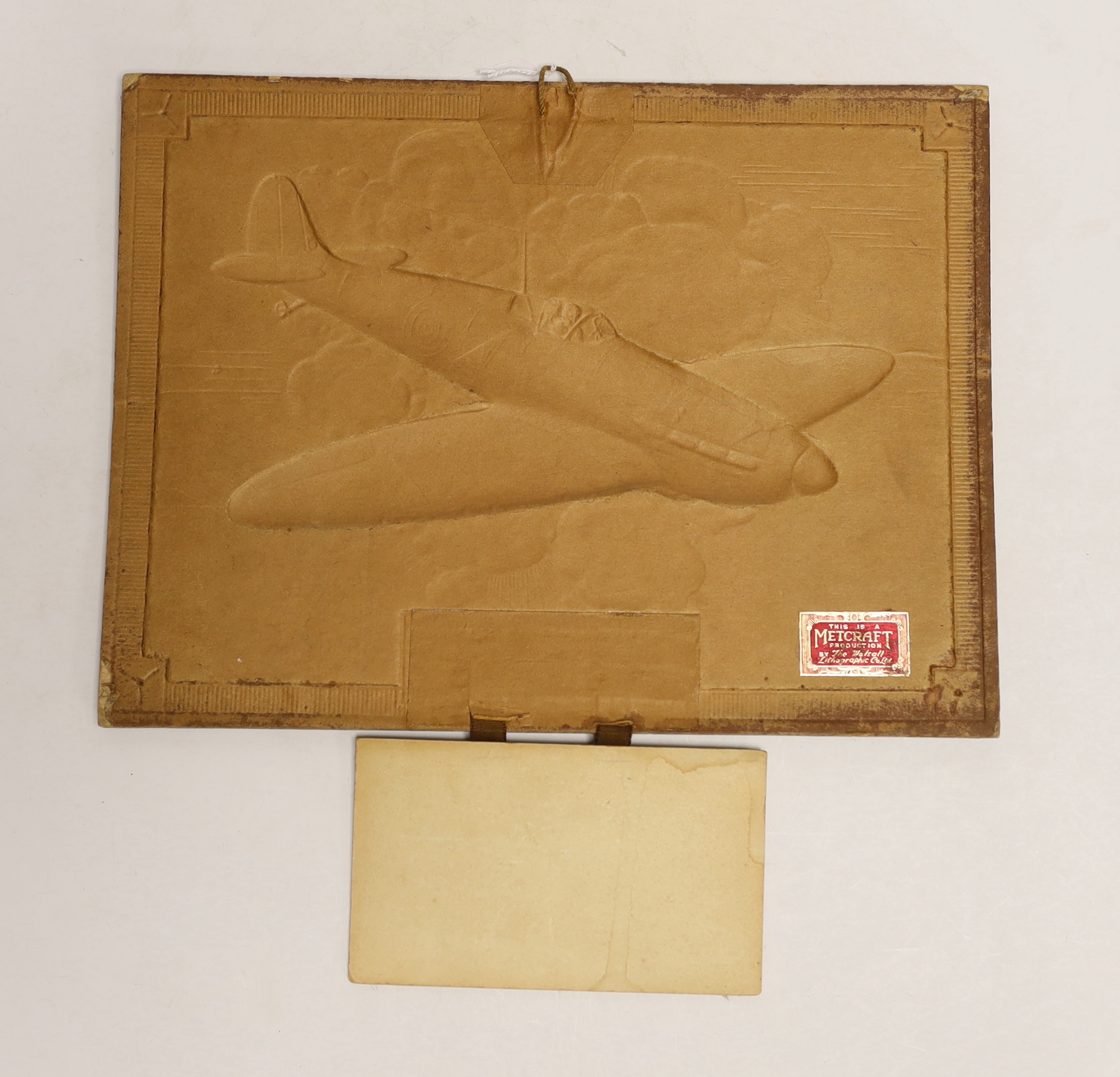 A World War Two bronzed calendar for 1941, signed Alex Henshaw, 32 x 30.5cm